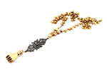 FISTS OF FURY BLACK & GOLD FILAGREE NECKLACE